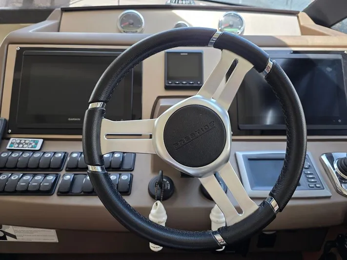 Just Peachy Yacht Photos Pics Steering wheel and dashboard of 2015 Prestige 550 Fly yacht.