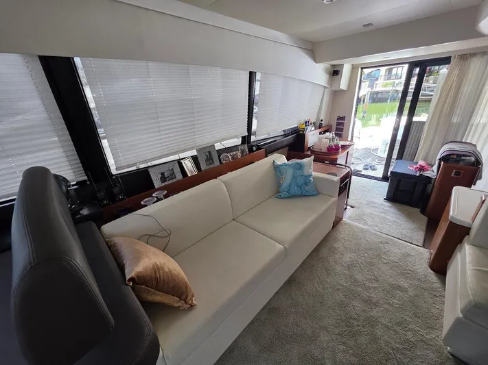 Just Peachy Yacht Photos Pics Luxurious interior of a 2015 Prestige 550 Fly yacht with elegant seating and decor.