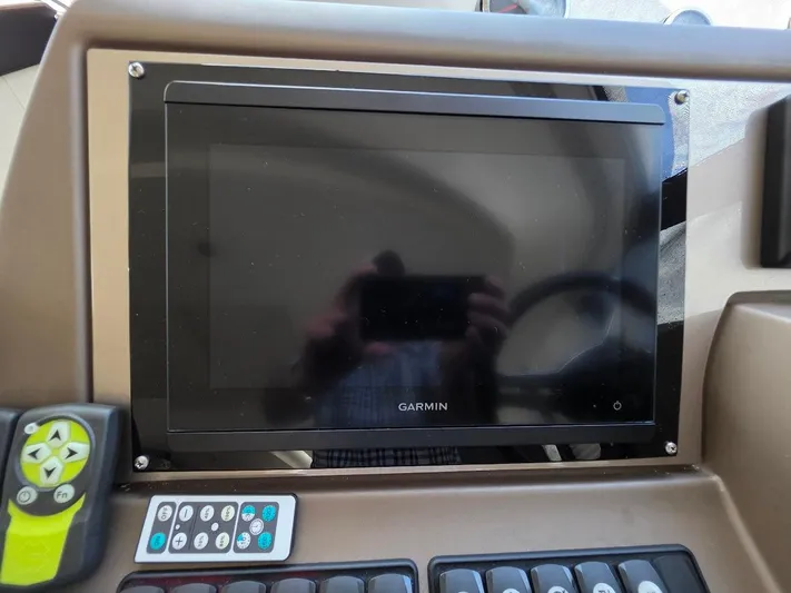 Just Peachy Yacht Photos Pics Garmin display and controls on 2015 Prestige 550 Fly yacht dashboard.