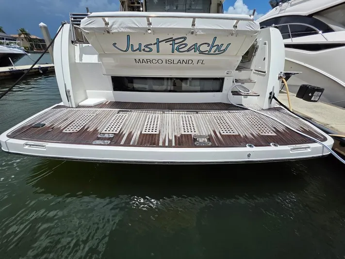 Just Peachy Yacht Photos Pics Rear view of 2015 Prestige 550 Fly yacht, docked at Marco Island, FL.