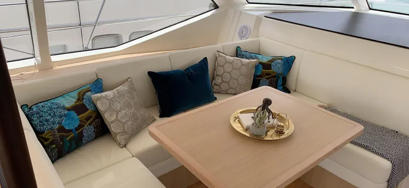 Charis Yacht Photos Pics Luxurious interior of 2020 Aquila 44 Yacht with elegant seating and decorative pillows.