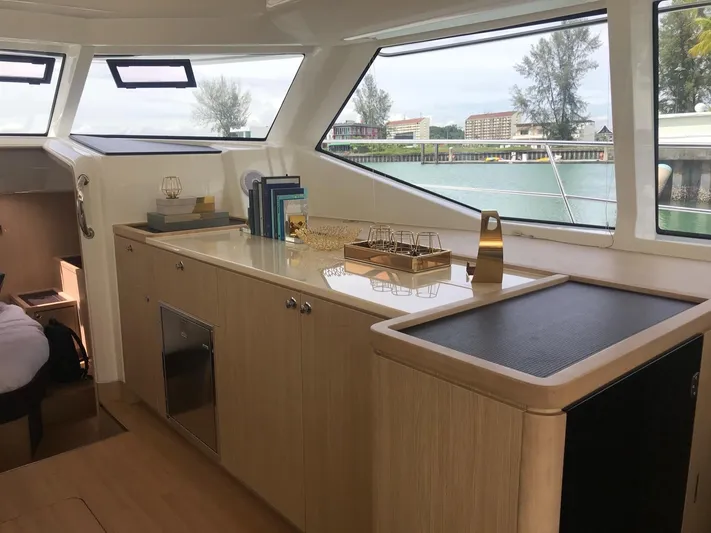 Charis Yacht Photos Pics Interior of 2020 Aquila 44 Yacht with elegant cabinetry and large windows.