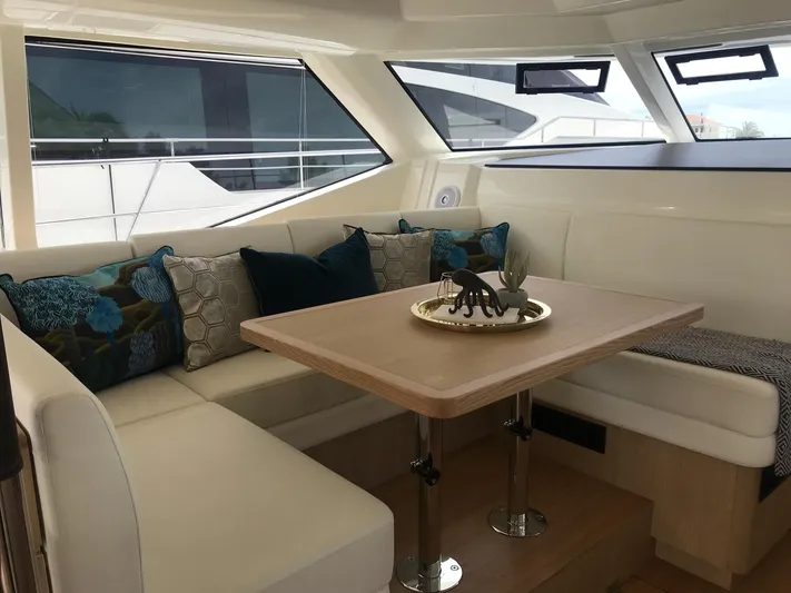 Charis Yacht Photos Pics Luxurious interior of 2020 Aquila 44 Yacht with elegant seating and decorative pillows.