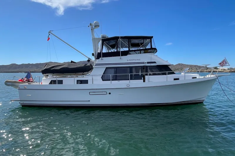  Yacht Photos Pics 1996 Ocean Alexander 456 Classico yacht on calm water under clear blue sky.