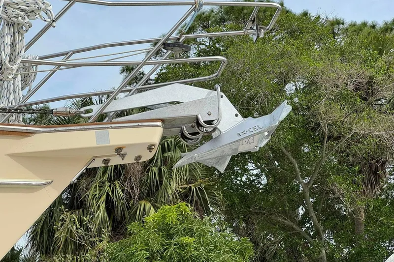 Texas Yacht Photos Pics Bow of 2001 Island Packet 420 sailboat with anchor, surrounded by lush greenery.