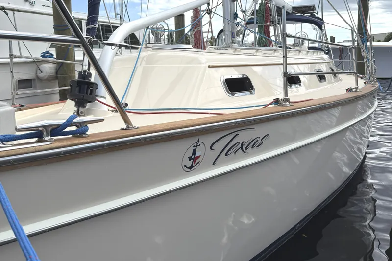Texas Yacht Photos Pics Island Packet 420 sailboat, 2001 model, docked with "Texas" name on hull.
