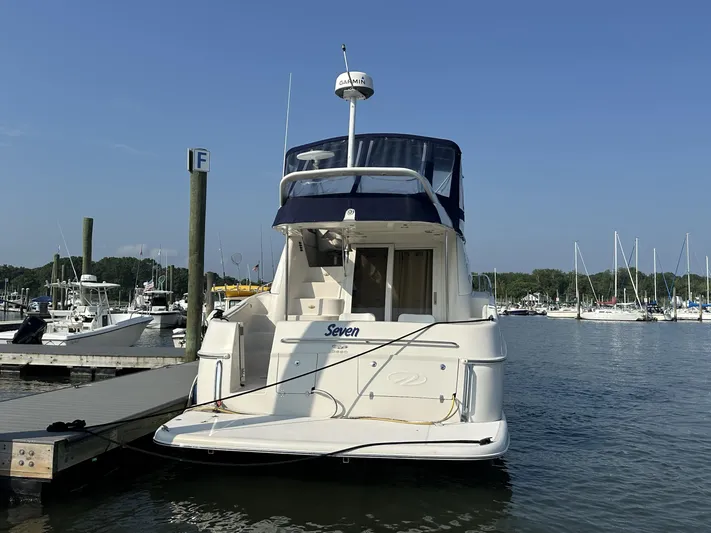  Yacht Photos Pics 2002 Regal 3880 yacht docked at marina under clear blue sky.
