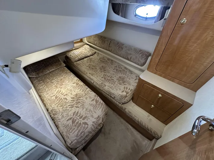  Yacht Photos Pics 2002 Regal 3880 yacht cabin with twin beds and wooden cabinetry.