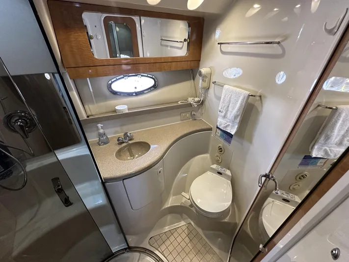  Yacht Photos Pics Luxurious 2002 Regal 3880 yacht bathroom with modern fixtures and elegant design.