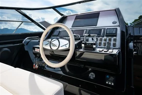 Voltor Yacht Photos Pics 2016 Riva 63 Virtus cockpit with modern steering and instruments.