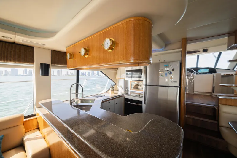 Salmonete Yacht Photos Pics Luxurious 1999 Bayliner 5788 yacht interior with modern kitchen and ocean view.
