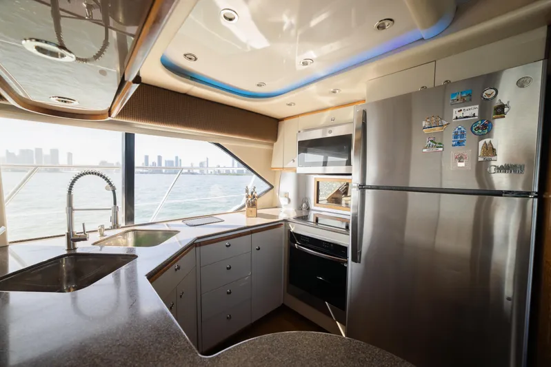 Salmonete Yacht Photos Pics Modern kitchen interior on a 1999 Bayliner 5788 yacht with city skyline view.