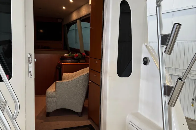 City Island Yacht Photos Pics Interior view of 2005 Fifth Ocean Yachts 46 SS, featuring elegant seating and cabinetry.