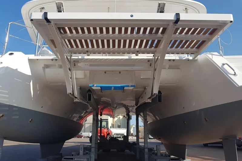  Yacht Photos Pics 2018 Lagoon 450 F catamaran on dry dock, showcasing hull and deck structure.