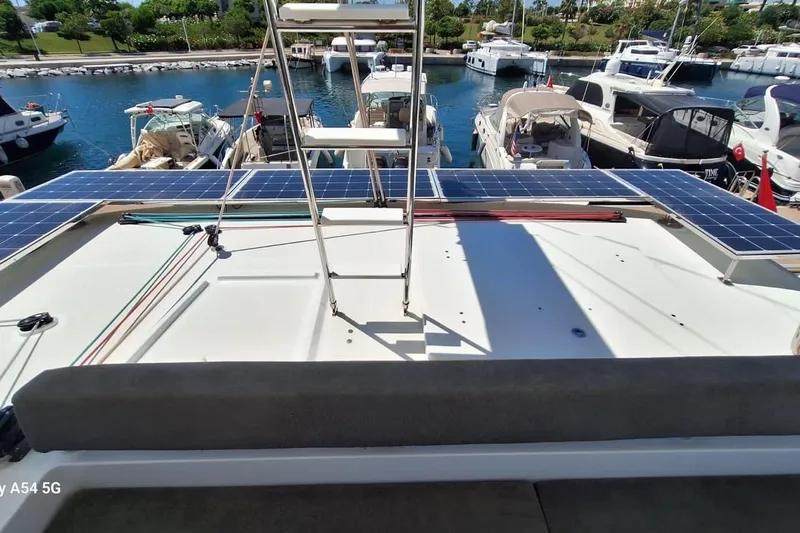  Yacht Photos Pics Lagoon 450 F 2018 catamaran with solar panels docked at marina.