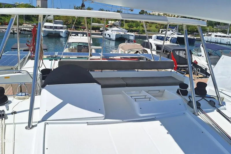  Yacht Photos Pics 2018 Lagoon 450 F catamaran docked at marina, featuring spacious deck and seating area.