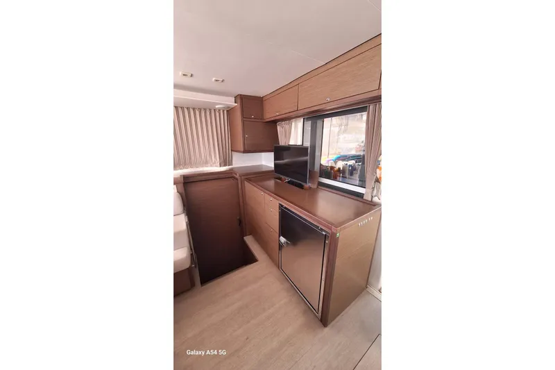  Yacht Photos Pics Interior of 2018 Lagoon 450 F yacht with modern cabinetry and window view.