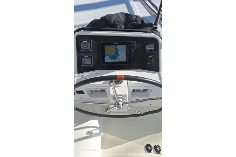  Yacht Photos Pics Steering console of 2018 Lagoon 450 F catamaran with navigation equipment and controls.