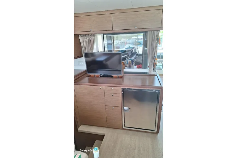  Yacht Photos Pics Interior of 2018 Lagoon 450 F yacht with TV and mini fridge.