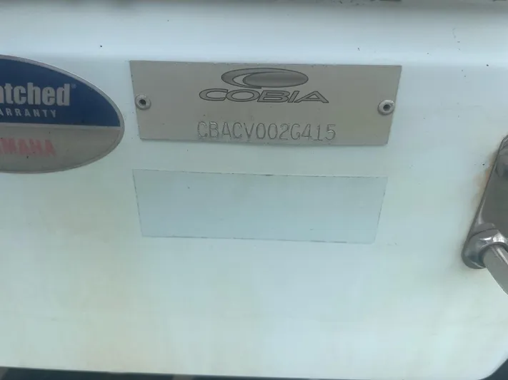 No Name Yacht Photos Pics 2015 Cobia 344 Center Console boat identification plate with warranty badge.