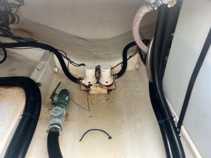 No Name Yacht Photos Pics Bilge area of 2015 Cobia 344 Center Console with hoses and fittings.