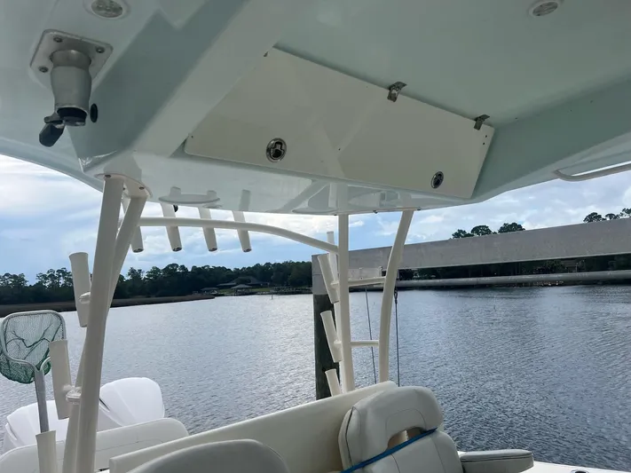 No Name Yacht Photos Pics 2015 Cobia 344 Center Console boat interior with rod holders and water view.