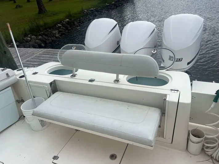 No Name Yacht Photos Pics 2015 Cobia 344 Center Console boat with triple outboard engines and seating area.