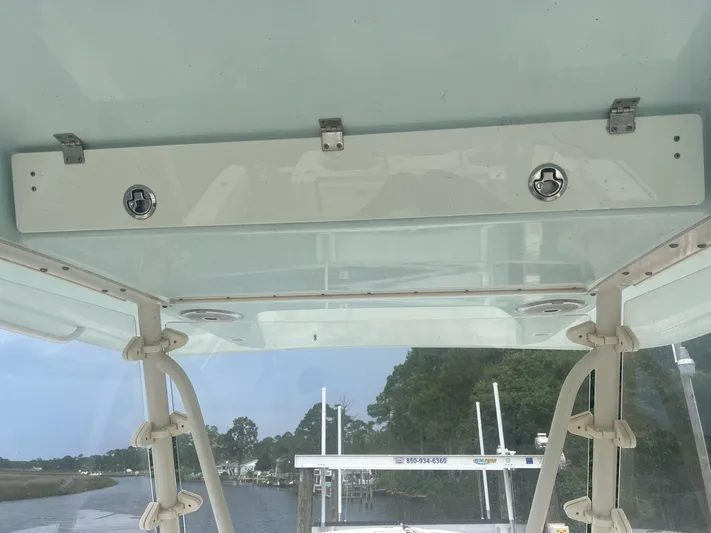 No Name Yacht Photos Pics 2015 Cobia 344 Center Console boat interior roof with latches and clear sky view.
