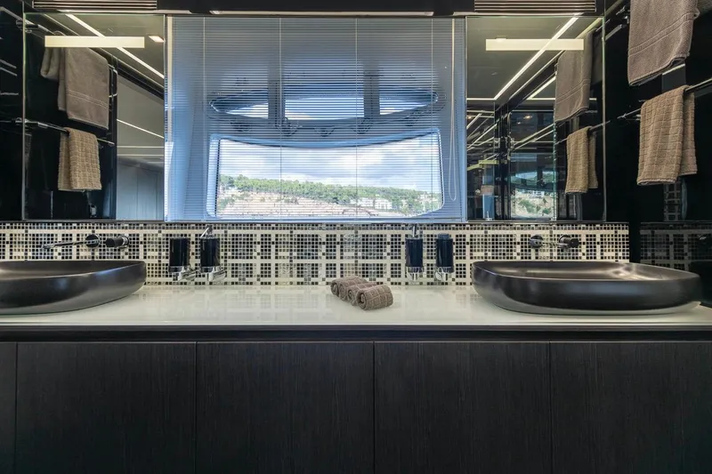 Aldebaran III Yacht Photos Pics Luxurious bathroom interior of 2018 Pershing 108 yacht with modern sinks and elegant design.