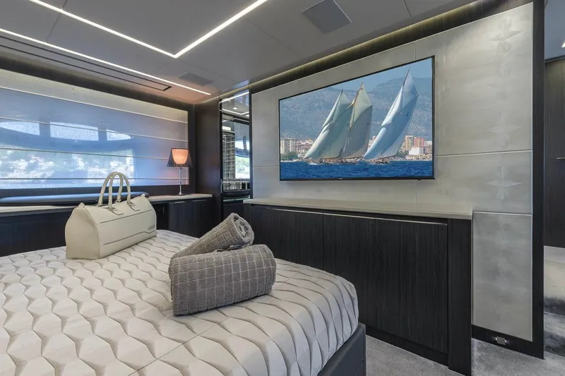 Aldebaran III Yacht Photos Pics Luxurious bedroom interior on 2018 Pershing 108 yacht with elegant decor and large TV.