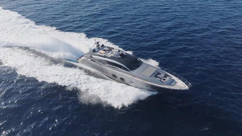 Aldebaran III Yacht Photos Pics 2018 Pershing 108 yacht cruising on open sea, creating a dynamic wake.
