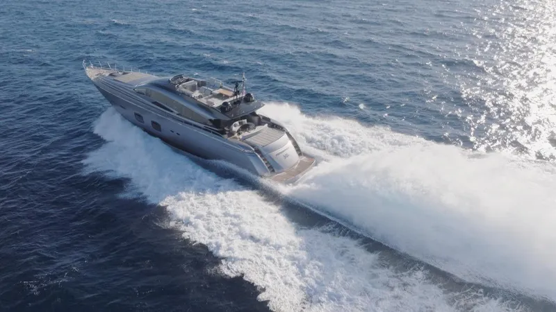 Aldebaran III Yacht Photos Pics 2018 Pershing 108 yacht cruising on open sea, creating a dynamic wake.