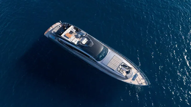 Aldebaran III Yacht Photos Pics Aerial view of 2018 Pershing 108 yacht cruising on open blue sea.