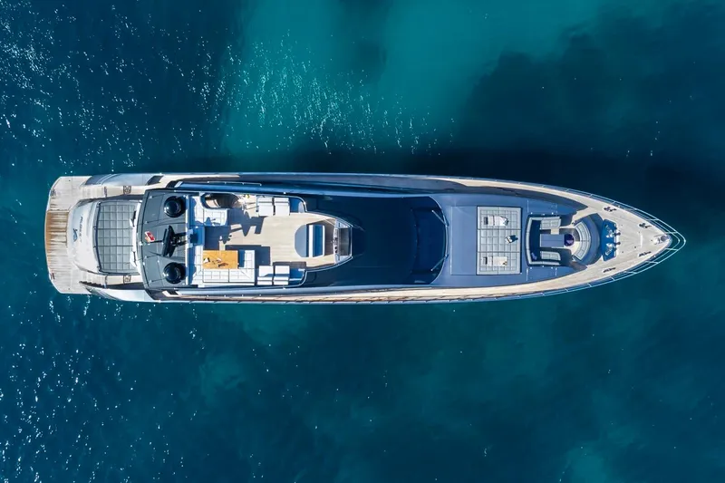 Aldebaran III Yacht Photos Pics Aerial view of 2018 Pershing 108 yacht on clear blue water.