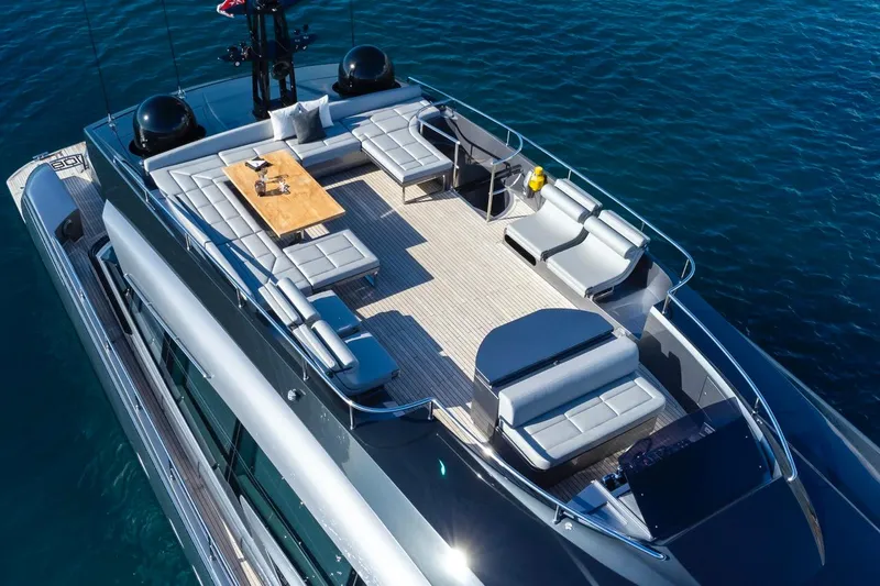 Aldebaran III Yacht Photos Pics Luxurious 2018 Pershing 108 yacht deck with elegant seating and dining area on the water.
