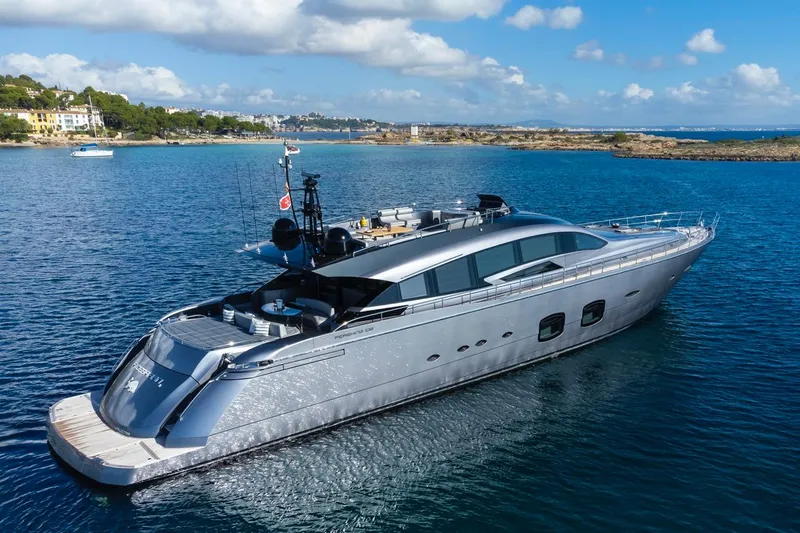 Aldebaran III Yacht Photos Pics Luxurious 2018 Pershing 108 yacht cruising in clear blue waters near a scenic coastline.