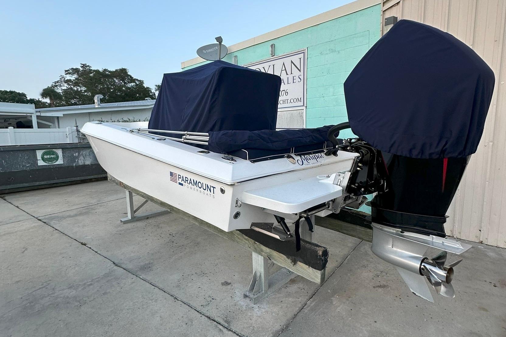 2022 Paramount 21 powerboat with covered engine, parked on a stand outdoors.