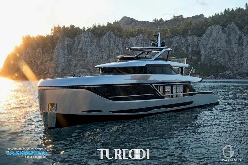 Azzurra Custom Platform 36m Yacht Photos Pics Luxurious 2027 Tureddi AZZURRA 36 yacht cruising near rocky coastline at sunset.