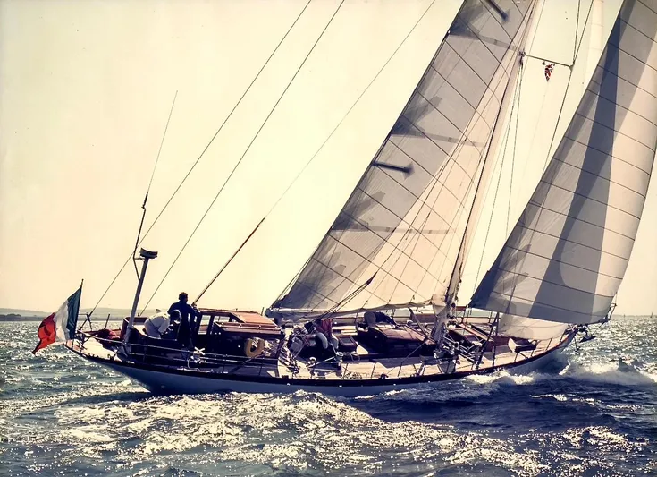 Juliette Yacht Photos Pics Vintage 1929 Custom Cutter Marconi sailboat navigating open waters with full sails.