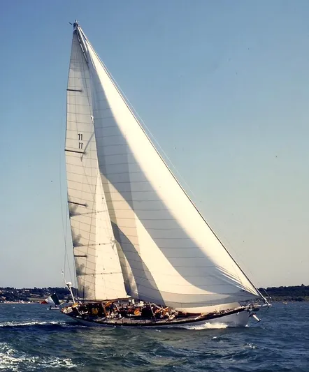 Juliette Yacht Photos Pics Vintage 1929 Custom Cutter Marconi sailboat gliding on open water under clear skies.