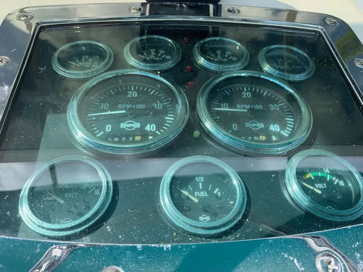 Legacy Yacht Photos Pics 1973 Bertram 31 Flybridge Cruiser dashboard with gauges and dials.