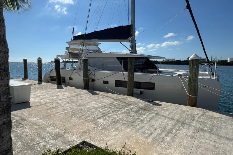 Ce Ya Yacht Photos Pics 2021 Leopard 45 catamaran docked at a sunny marina.