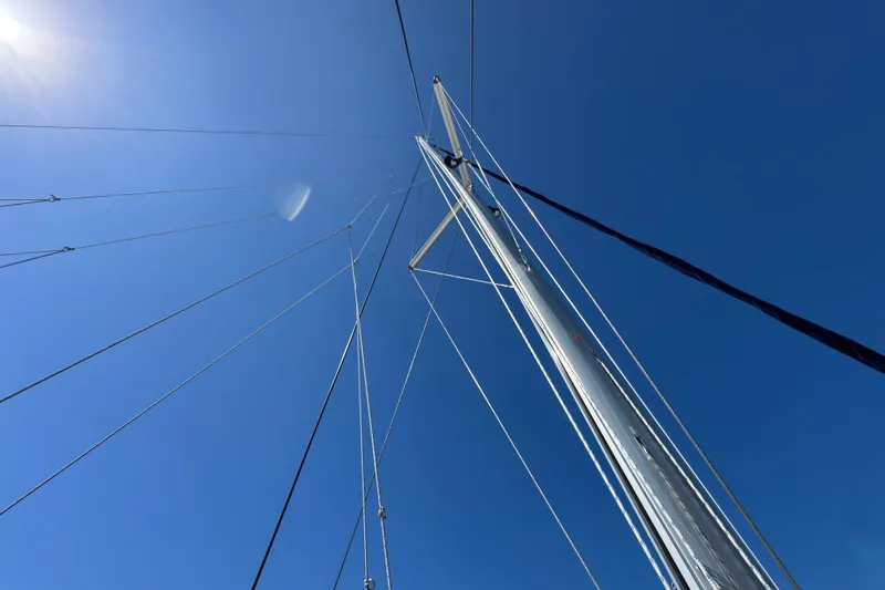 Ce Ya Yacht Photos Pics Sailboat mast and rigging against clear blue sky, Leopard 45, 2021 model.