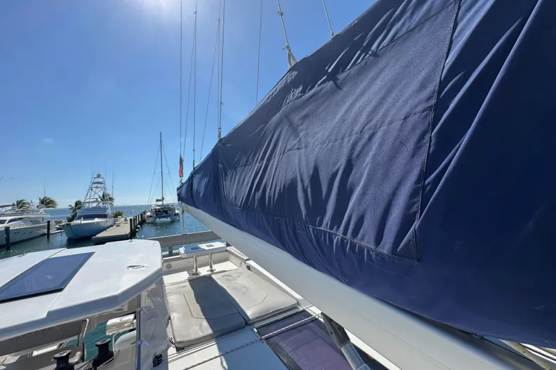 Ce Ya Yacht Photos Pics 2021 Leopard 45 sailboat docked at marina under clear blue sky.