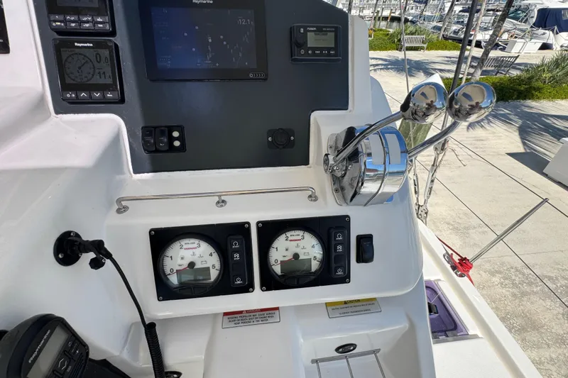 Ce Ya Yacht Photos Pics Control panel of a 2021 Leopard 45 yacht with navigation instruments and throttle levers.