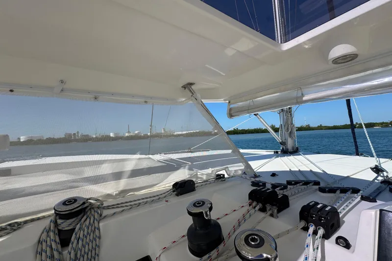 Ce Ya Yacht Photos Pics Interior view of a 2021 Leopard 45 catamaran with sailing equipment and ocean backdrop.