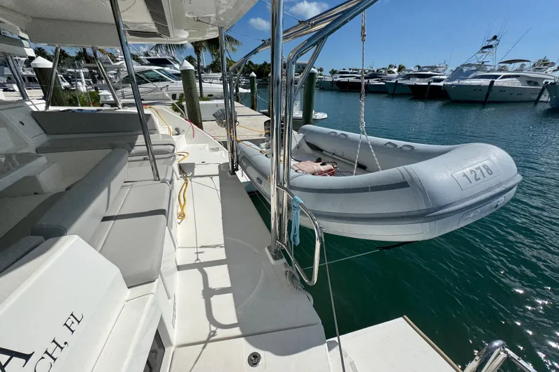 Ce Ya Yacht Photos Pics Leopard 45 catamaran with dinghy, docked at marina, sunny day, 2021 model.