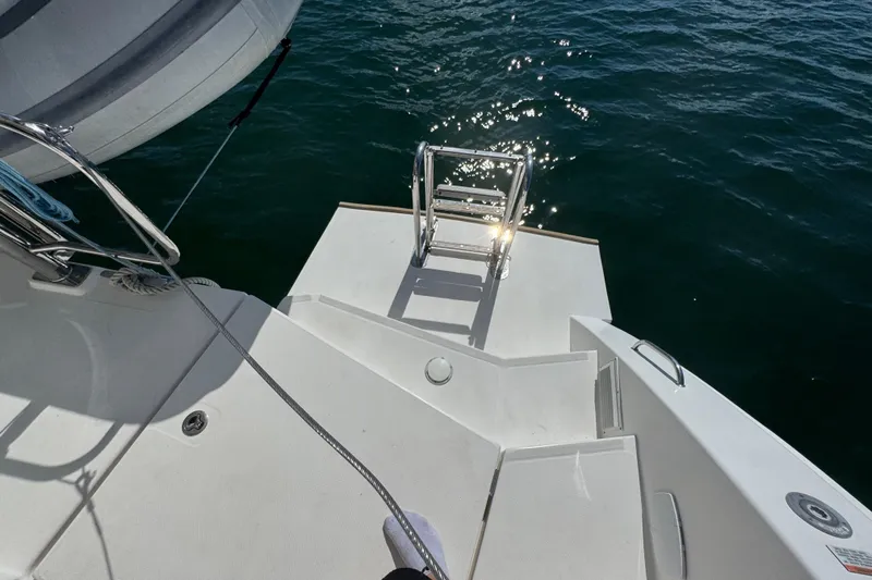 Ce Ya Yacht Photos Pics Sleek deck of 2021 Leopard 45 yacht with ladder and ocean view.