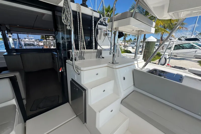 Ce Ya Yacht Photos Pics Interior view of a 2021 Leopard 45 catamaran, showcasing modern design and marina backdrop.