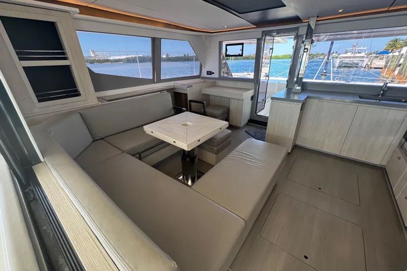 Ce Ya Yacht Photos Pics Modern interior of 2021 Leopard 45 yacht with spacious seating and panoramic windows.